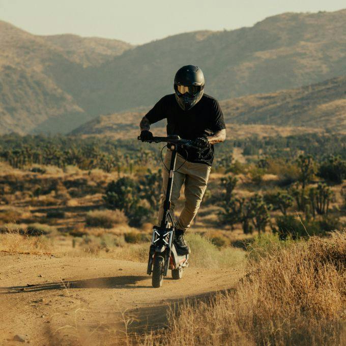 Segway electric scooter rider traveling on a dirt trail