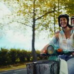 Traveller riding a moped on holiday, representing Staysure travel insurance