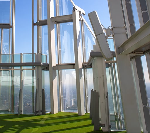 Visitors looking out from the open-air Skydeck at The Shard