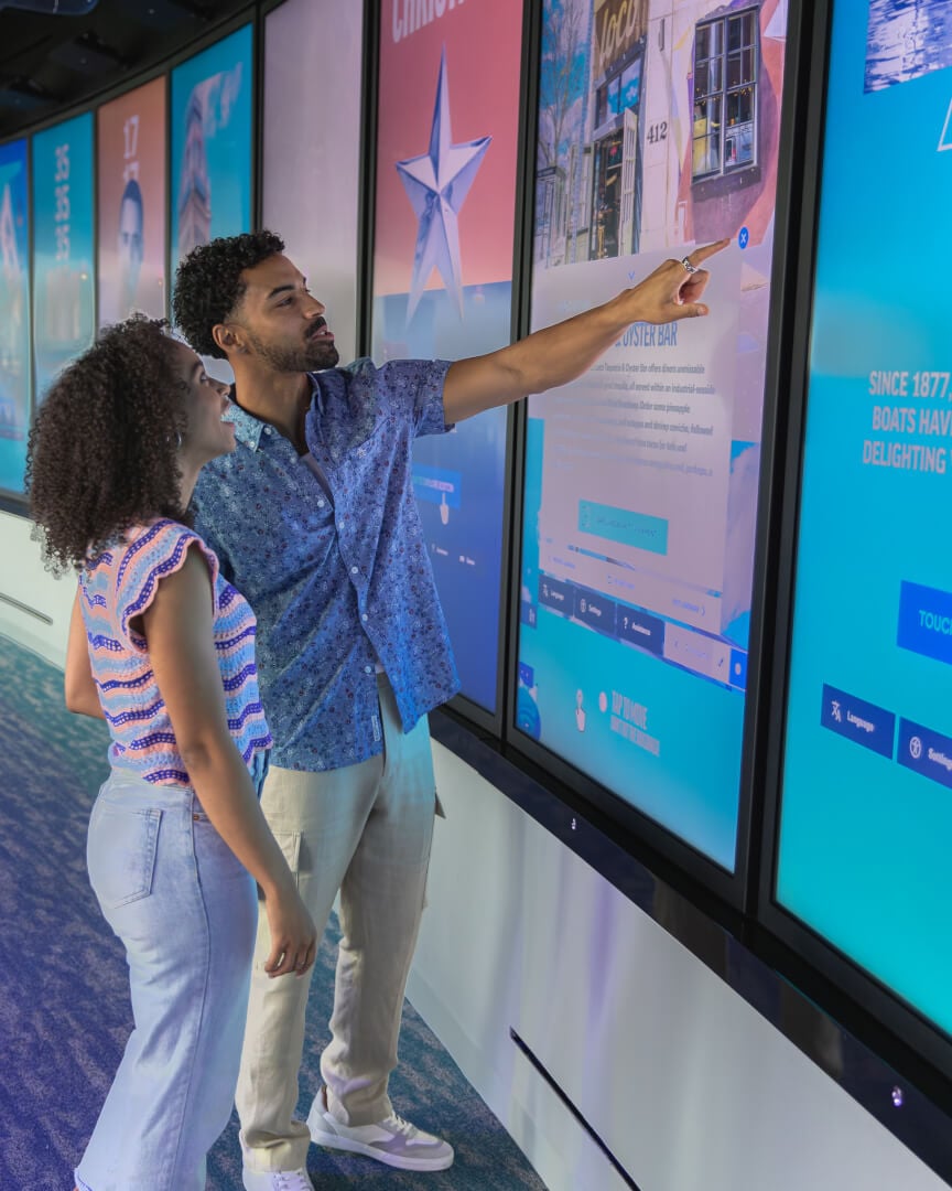 Visitors exploring an interactive View Boston experience