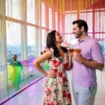 Visitors enjoying an immersive View Boston installation with the skyline beyond