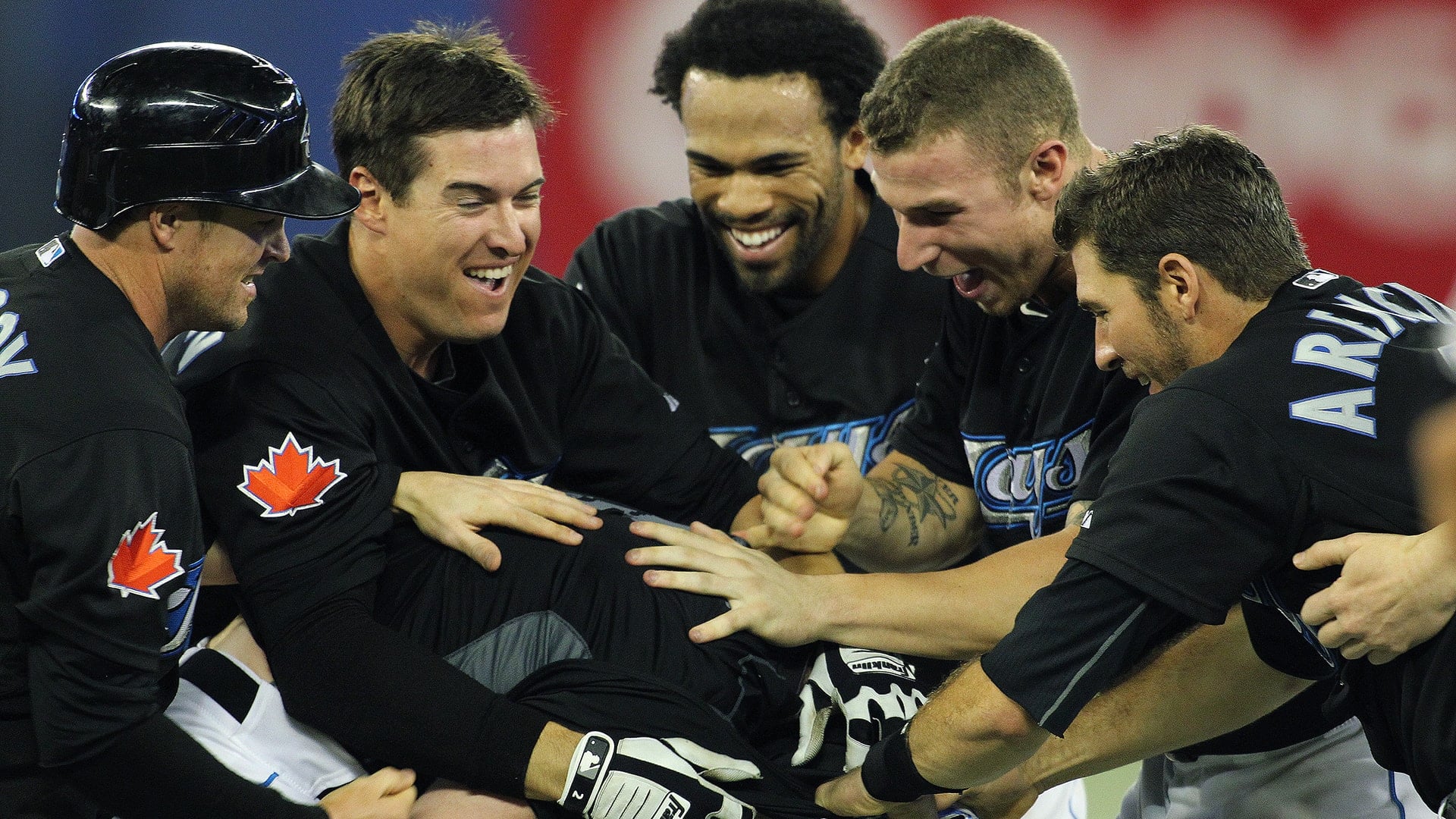 Blue Jays players celebrating together after a game