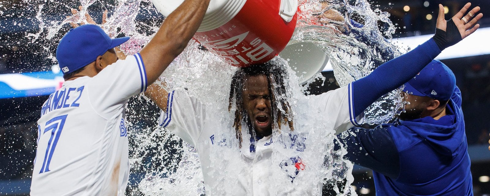 Blue Jays players celebrating with a water cooler
