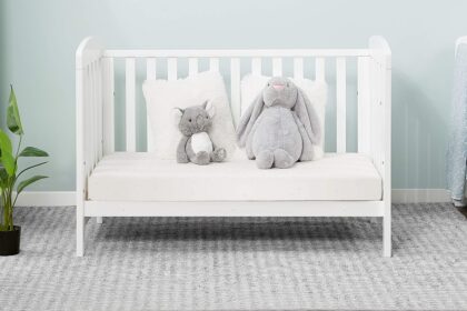 Alice cot bed shown in a softly styled nursery