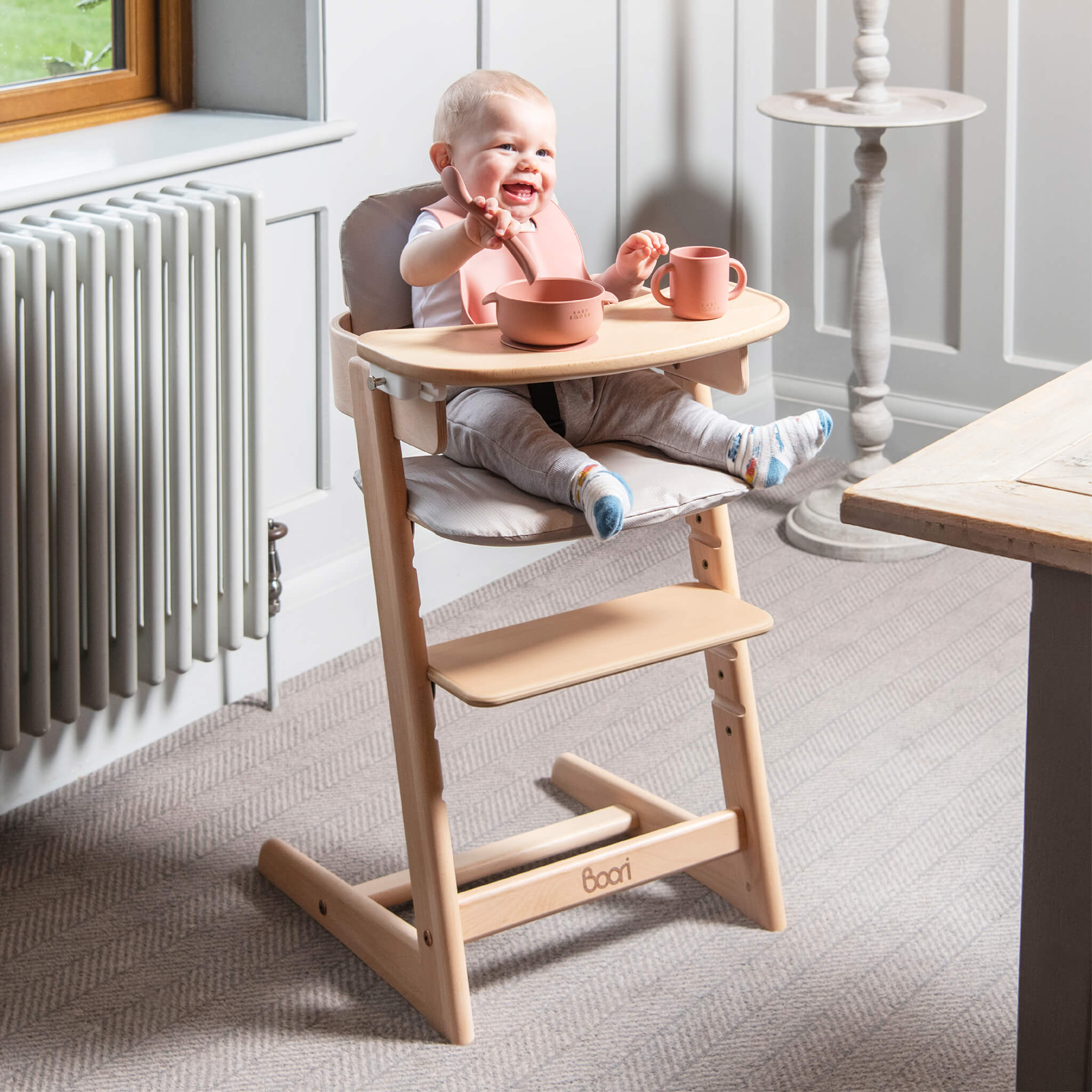 Boori Tidy highchair beside a family dining table