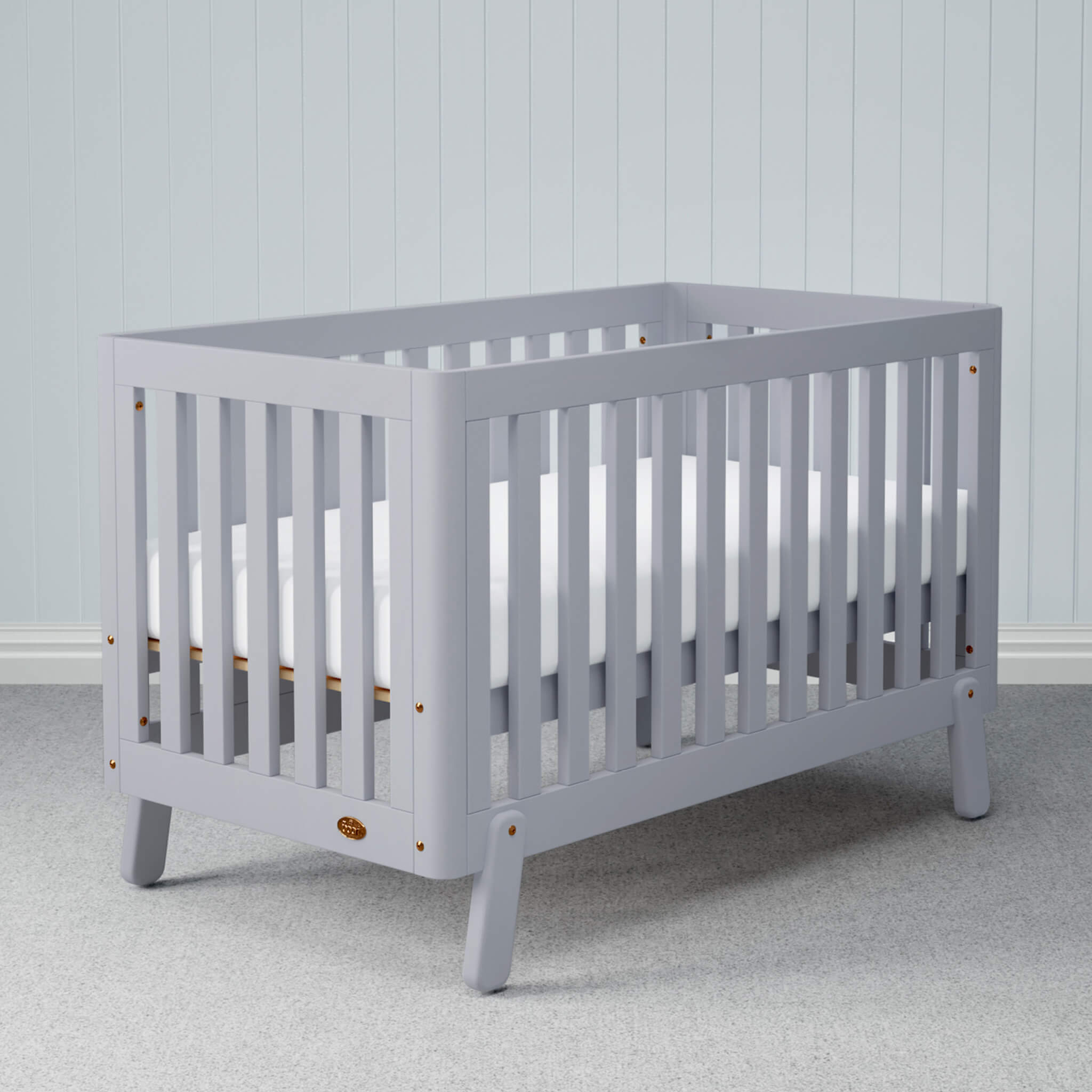 Turin cot bed in a nursery setting