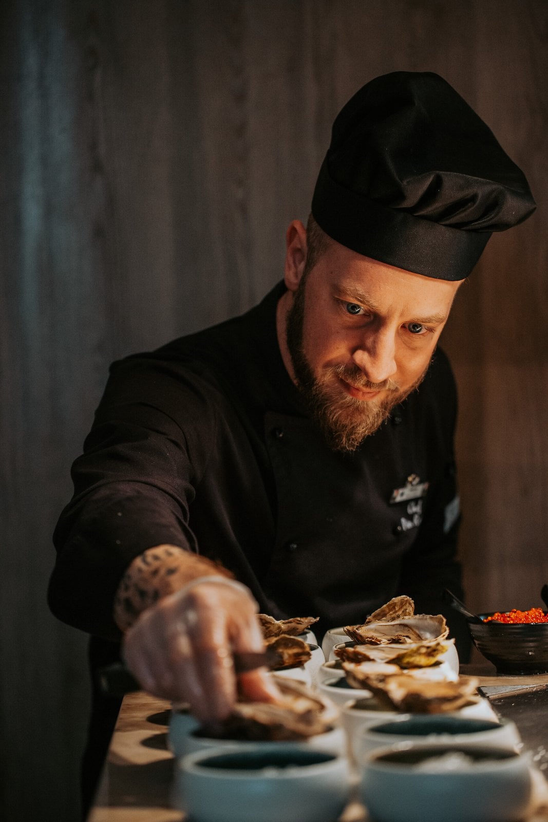 A chef serving food in a resort restaurant