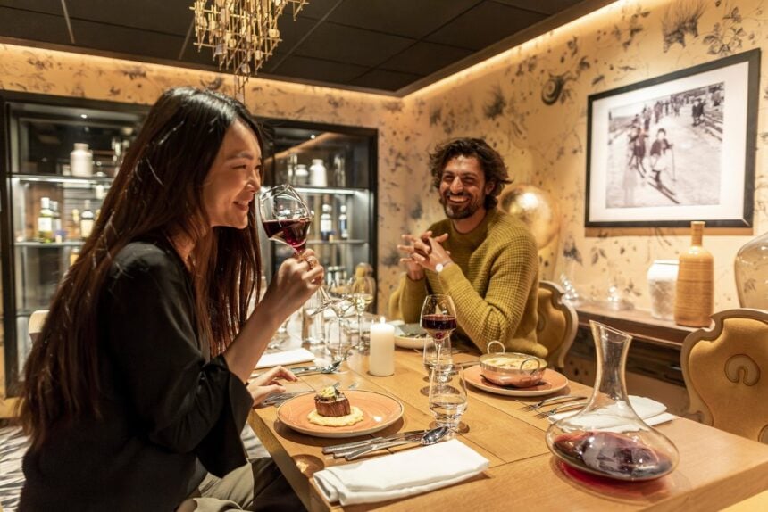 Two guests sharing a meal at a Club Med resort restaurant