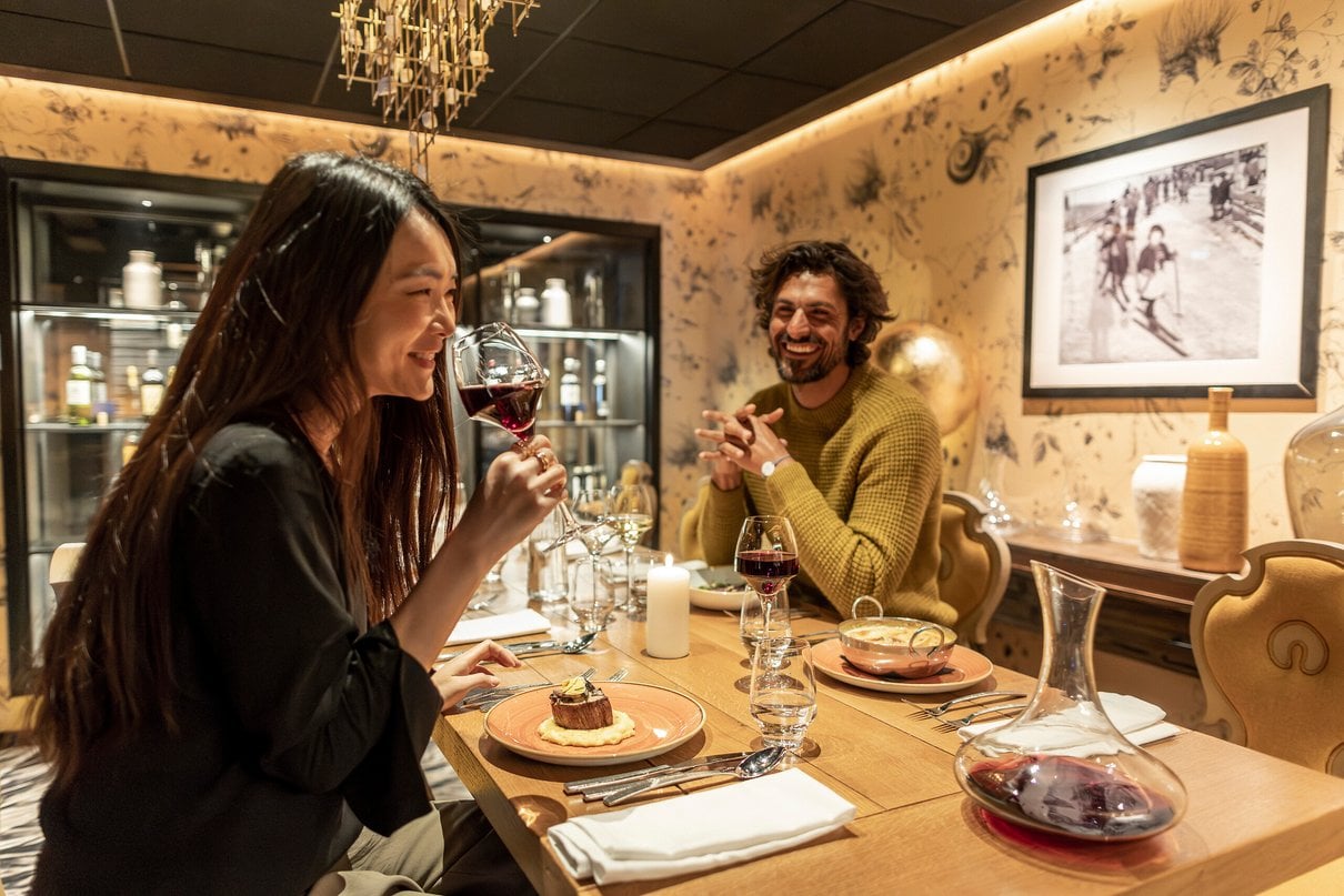 Two guests sharing a meal at a Club Med resort restaurant