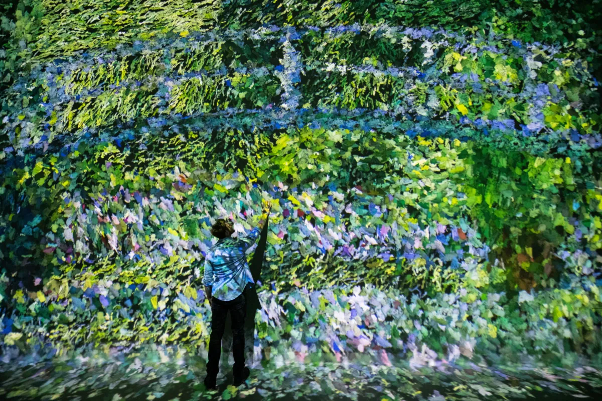 A projected Monet artwork filling a Frameless gallery wall