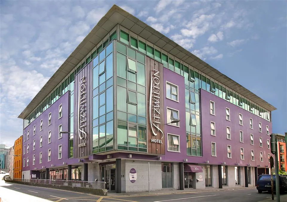 Contemporary hotel facade beside a city street
