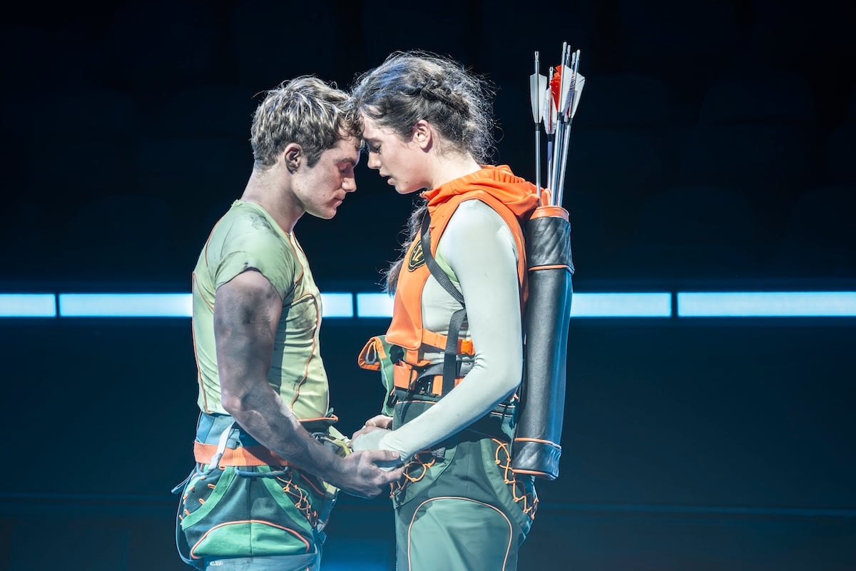 A performer appears in a Hunger Games on Stage scene