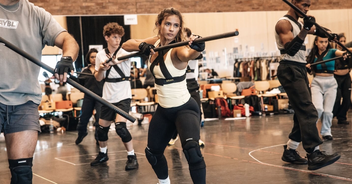 Performers in costume on the Hunger Games on Stage set