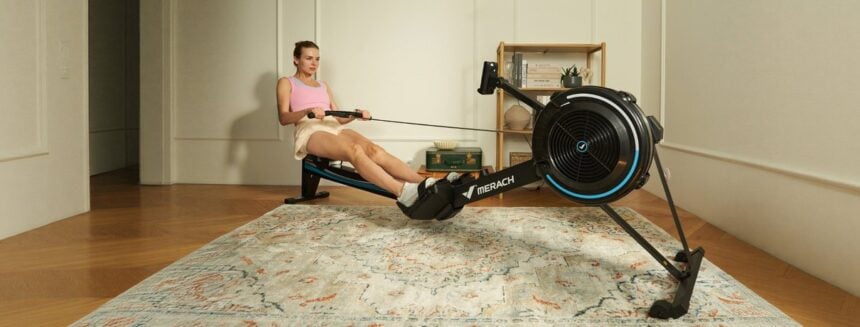 Merach R50 air resistance rowing machine in a home workout setting