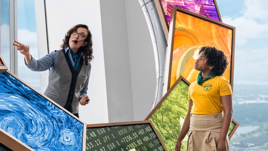 A guide and visitor at an interactive exhibit in One World Observatory