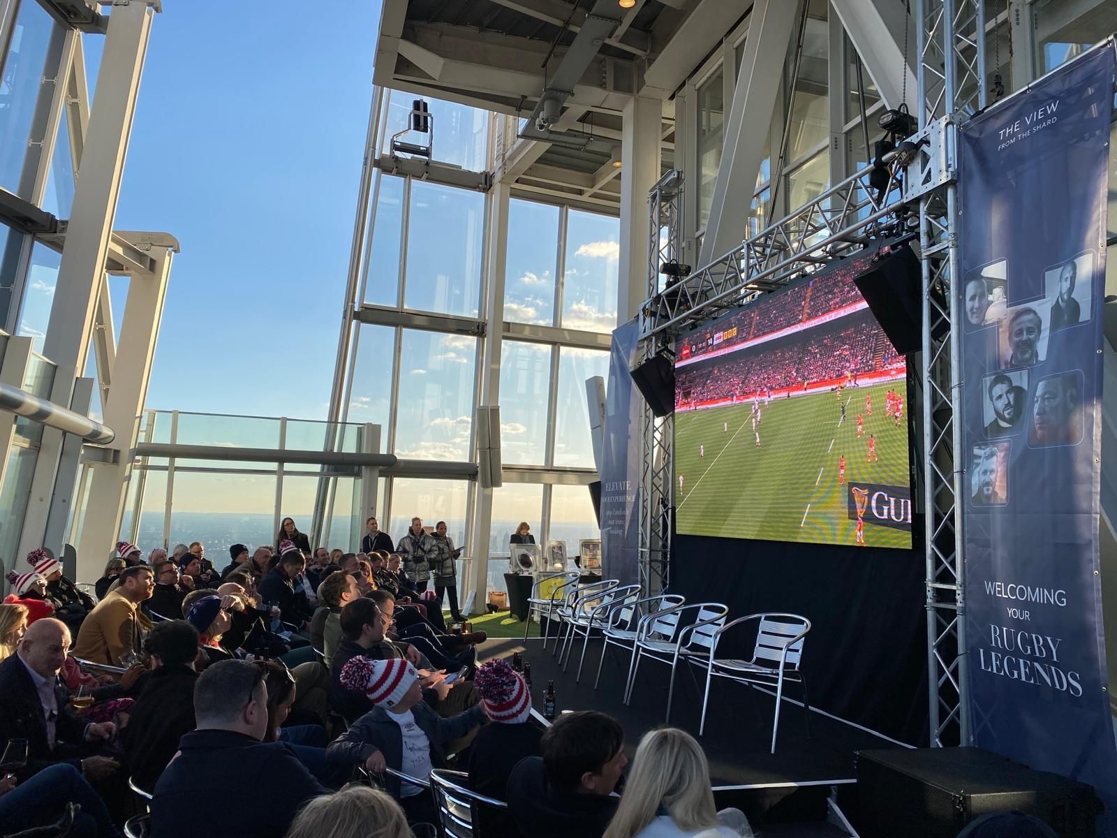 Guests watching a rugby screening in the Shard viewing space
