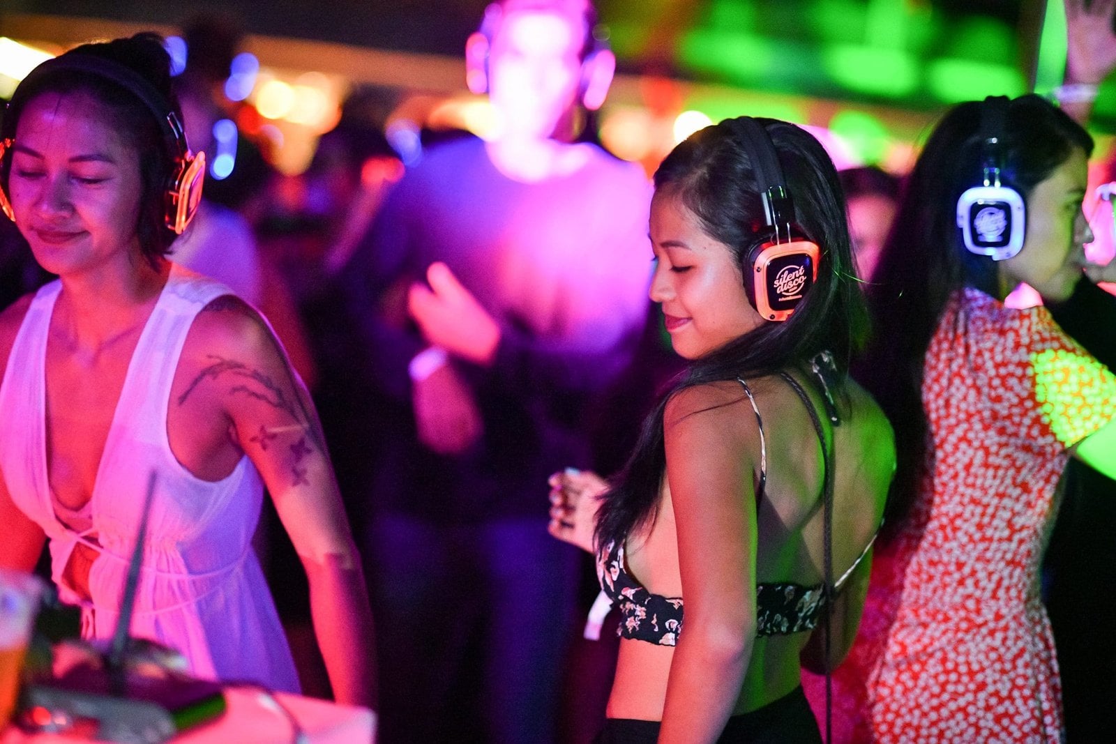Guests wearing headphones at a silent disco in The Shard
