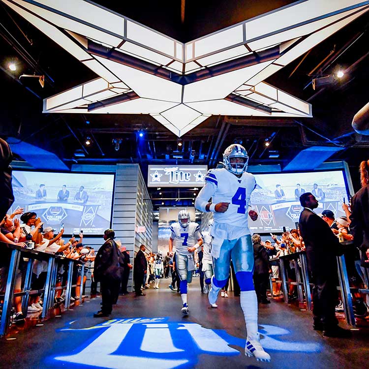 Group taking part in a skills challenge at AT&T Stadium