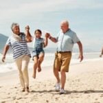 Family walking together along a beach