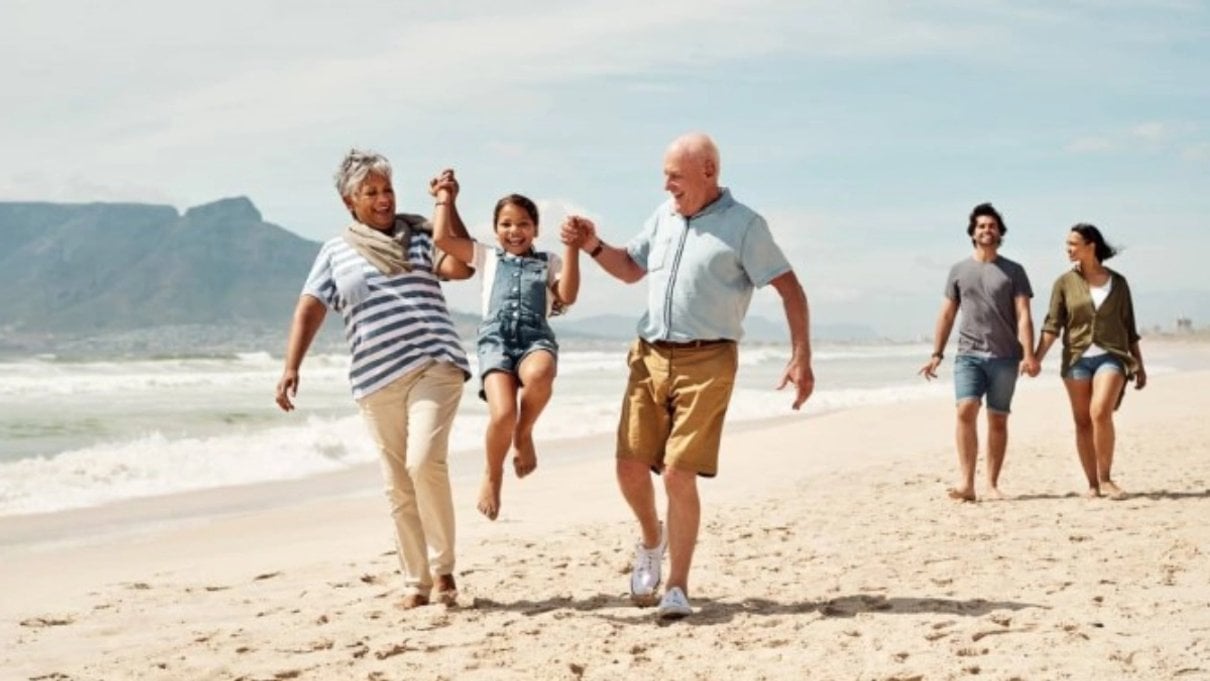 Family walking together along a beach