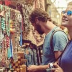 Couple browsing a market while travelling