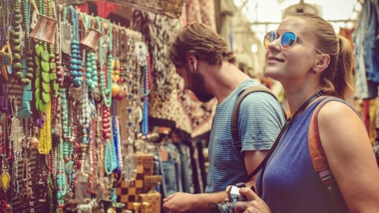 Couple browsing a market while travelling