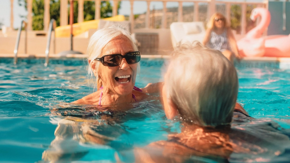 Women swimming in a holiday pool