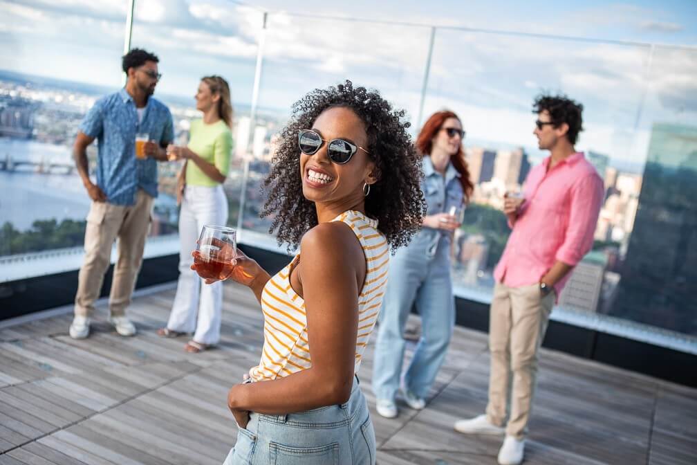 Visitors on the rooftop deck overlooking Boston