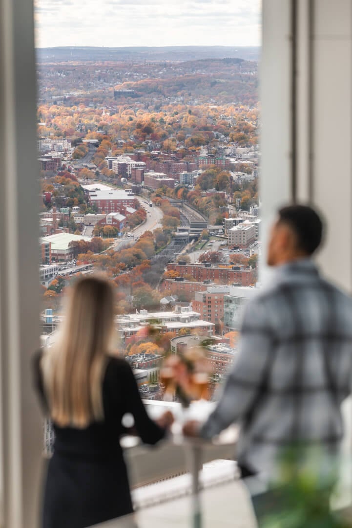 Visitors looking across an autumn Boston cityscape